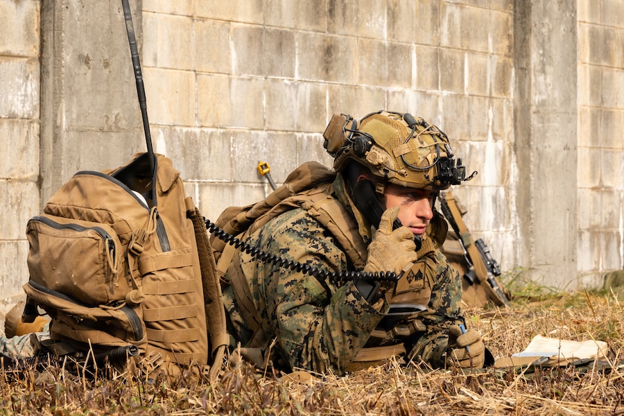 U.S. Marine Corps Sgt. Estevan Diaz, a mortarman with 1st Battalion, 6th Marines, forward deployed with 4th Marine Regiment, 3rd Marine Division as part of the Unit Deployment Program, checks his radio while conducting platoon attacks in an urban environment during Korea Viper 26.1 at Camp Rodriguez, South Korea, Dec. 17, 2025.