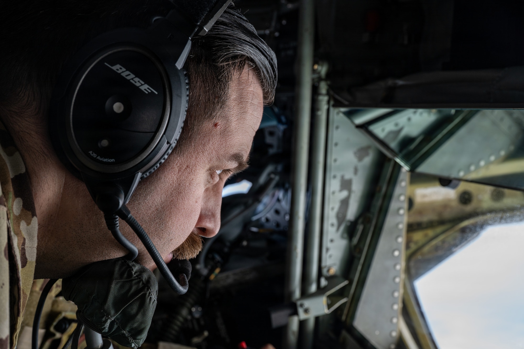 U.S. Air Force Staff Sgt Nicholas Vietri, a boom operator with the 459th Air Refueling Wing, Maryland, operates the boom of a KC-135 Stratotanker over the southeastern United States December 18, 2025. The KC-135 is the U.S. Air Force's core aerial refueling platform, extending the global reach of the Air Force, Navy, Marine Corps, and allied nations. (U.S. Air Force photo by Tech. Sgt. Tiffany A. Emery)