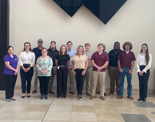 Several SMART Scholars recently visited ERDC. Pictured in the front row (R to L) is SMART Army Component Liaison Laurie Perez, Natalie Harris, Claire Justis, Marin Sherwin, directorate of Human Capital Speler Montgomery, Thomas Dowe, Hunter Williams, and Hope George. Back row (R to L): Garrett Breithaupt, Tristan Calaway, Ander McDade, William Dowe, and Chance Williams