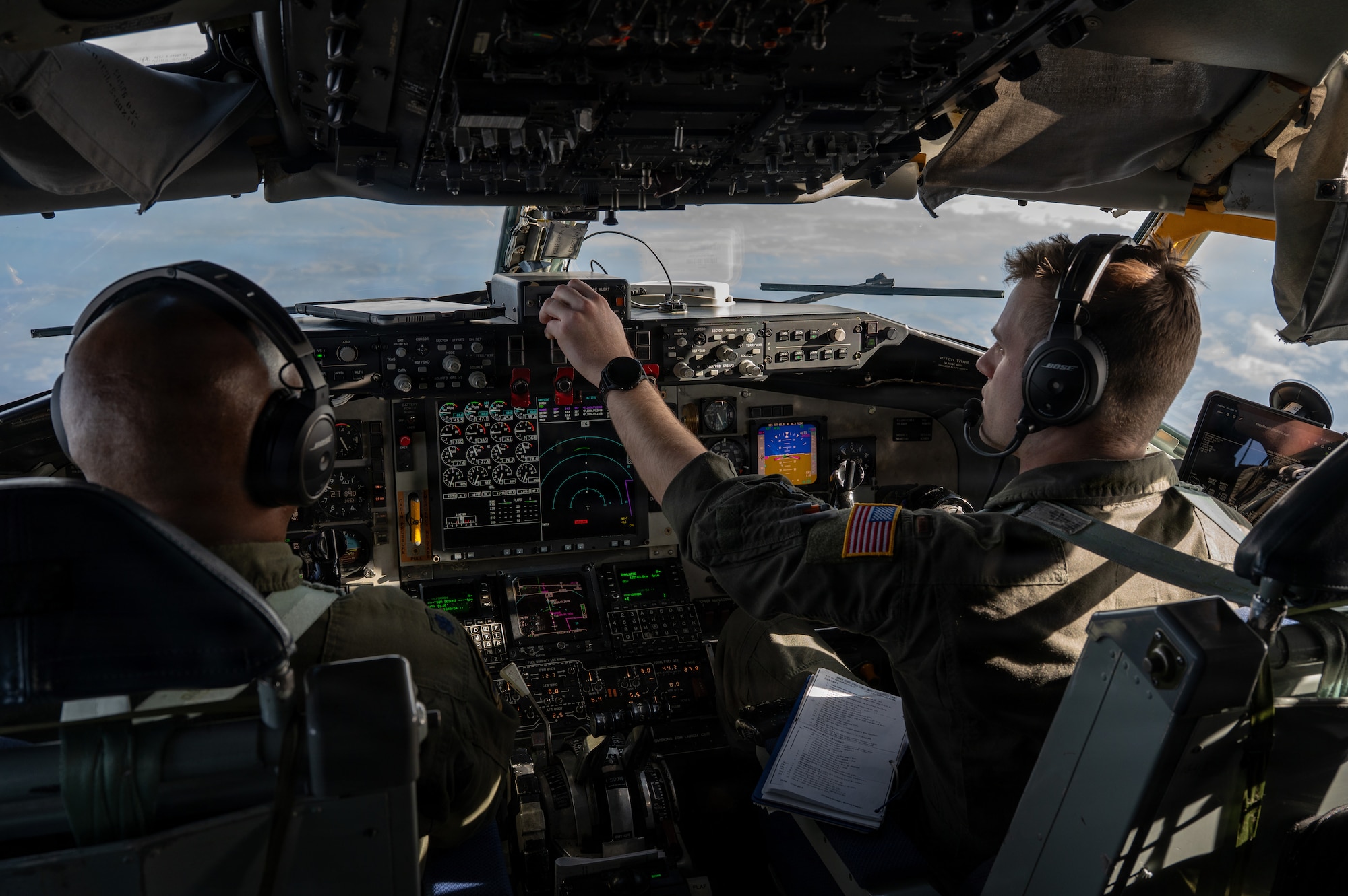 U.S. Air Force Lt. Col. Frank Gilliard and 2nd Lt. Kyle McCoy, pilots with the 459th Air Refueling Wing, Maryland, operate a KC-135 Stratotanker over the southeastern United States December 18, 2025. The KC-135 is the U.S. Air Force's core aerial refueling platform, extending the global reach of the Air Force, Navy, Marine Corps, and allied nations. (U.S. Air Force photo by Tech. Sgt. Tiffany A. Emery)