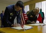 Maj. Gen. Rodney Boyd, the adjutant general of Illinois and commander of the Illinois National Guard, and Portuguese Lt. Gen. Rui Freitas sign the formal agreement creating the Department of War National Guard Bureau State Partnership Program between the Illinois National Guard and the Portuguese military on Jan. 12, 2026, at the Portuguese Ministry of Defense in Lisbon. The State Partnership Program is a Department of War initiative led by the National Guard that supports the security cooperation objectives of U.S. combatant commands and aligns with U.S. State Department strategies. Photo by Cpl. Justin Malone.