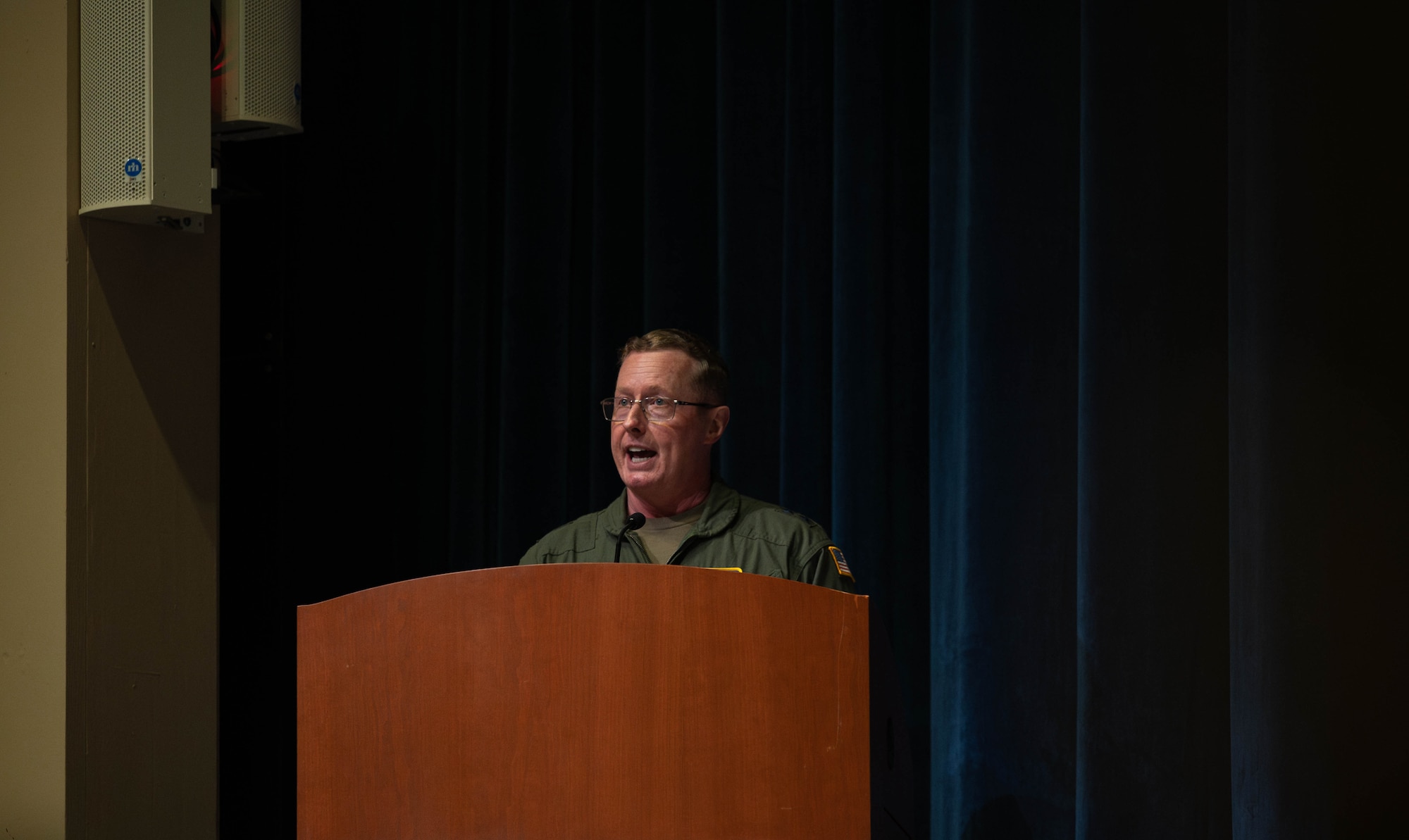 a person speaks to an audience