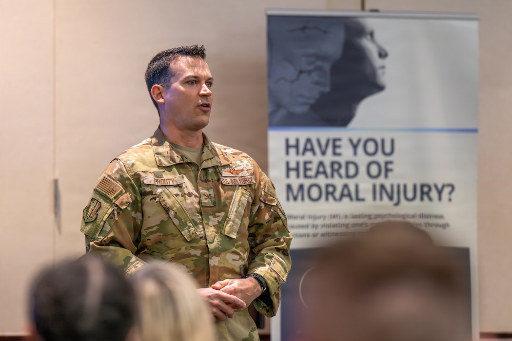 Colonel speaks to crowd during symposium