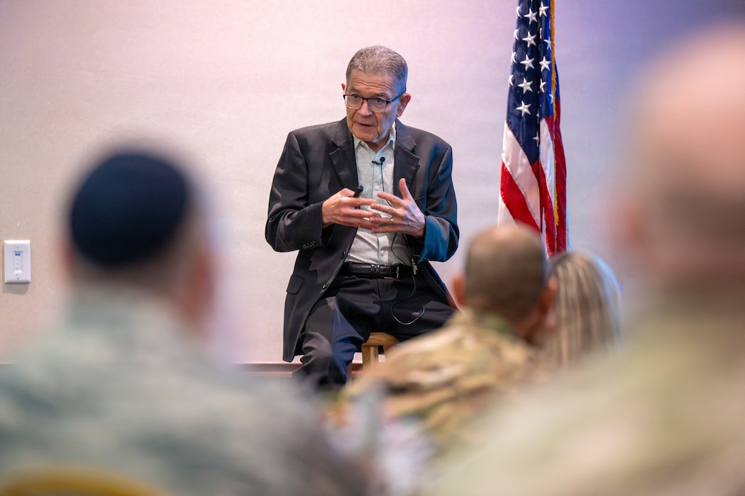 Man delivers speech during symposium