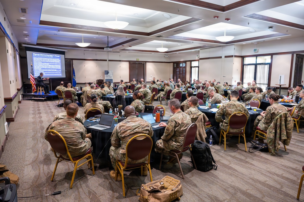 Audience listens to seminar in building