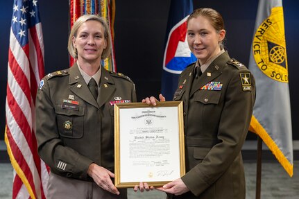 Col. Michelle M. Williams, U.S. Army Financial Management Command commander, presents a certificate of promotion to Col. Jennifer S. Pampuch Borden, USAFMCOM Reserve Component senior advisor and U.S. Army Reserve Medical Command assistant chief of staff for resource management, during Pampuch Borden’s promotion ceremony at the Maj. Gen. Emmett J. Bean Federal Center in Indianapolis, Jan. 9, 2026. Since her graduation for the U.S. Military Academy at West Point, Pampuch Borden served in all three Army components as both a military police officer and finance officer. (U.S. Army photo by Mark R. W. Orders-Woempner)