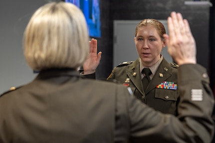 Col. Michelle M. Williams, U.S. Army Financial Management Command commander, administers an oath of office to Col. Jennifer S. Pampuch Borden, USAFMCOM Reserve Component senior advisor and U.S. Army Reserve Medical Command assistant chief of staff for resource management, during Pampuch Borden’s promotion ceremony at the Maj. Gen. Emmett J. Bean Federal Center in Indianapolis, Jan. 9, 2026. Since her graduation for the U.S. Military Academy at West Point, Pampuch Borden served in all three Army components as both a military police officer and finance officer. (U.S. Army photo by Mark R. W. Orders-Woempner)
