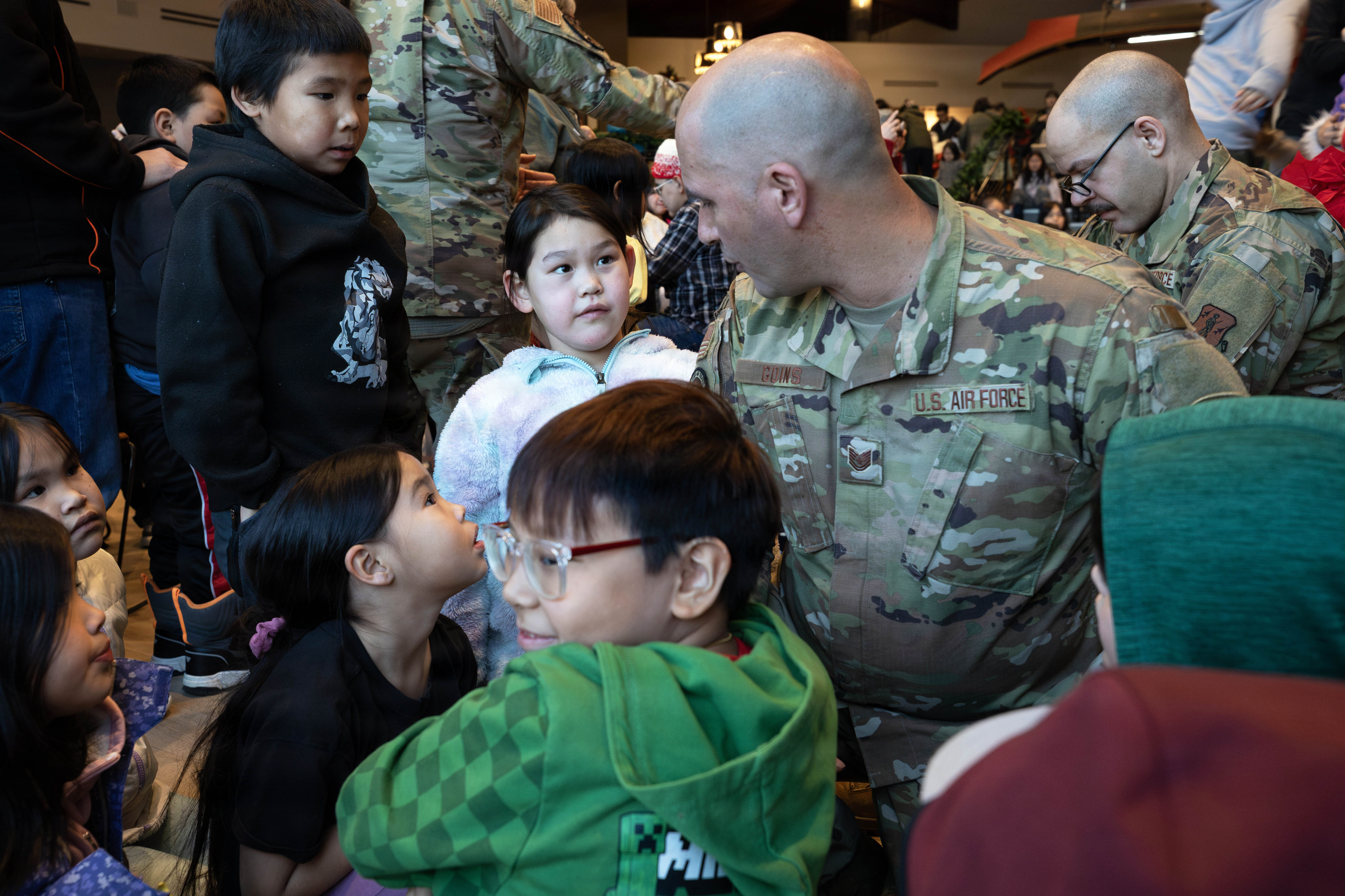 Soldiers load up a plan with boxs full of supplies and gifts from the Salvation Army