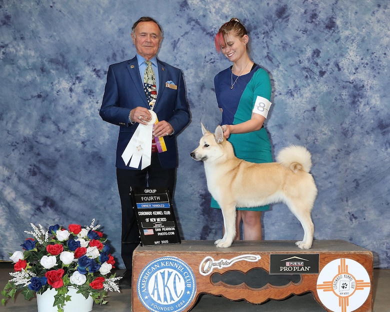 Morgan Humphrey stands with her buhund Erica after a show, June 2, 2025. “Erica got an Owner-Handled Group 4 and her first major points towards her championship,”
at this show, Humphrey said.