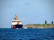 The USCGC Hickory (WLB 212), a 225-foot Juniper-class seagoing buoy tender, arrives in Apra Harbor as it comes to their new homeport in Guam on Jan. 14, 2026, following a more than 13,000-mile transit over 71 days from the U.S. Coast Guard Yard in Baltimore through the Panama Canal. After an extended Major Maintenance Availability at the Yard, part of the In-Service Vessel Sustainment Program that modernizes the entire Juniper-class fleet with hull repairs, system upgrades, and replacement of obsolete equipment, the Hickory is now fully revitalized. (U.S. Coast Guard photo by Chief Warrant Officer Muir)