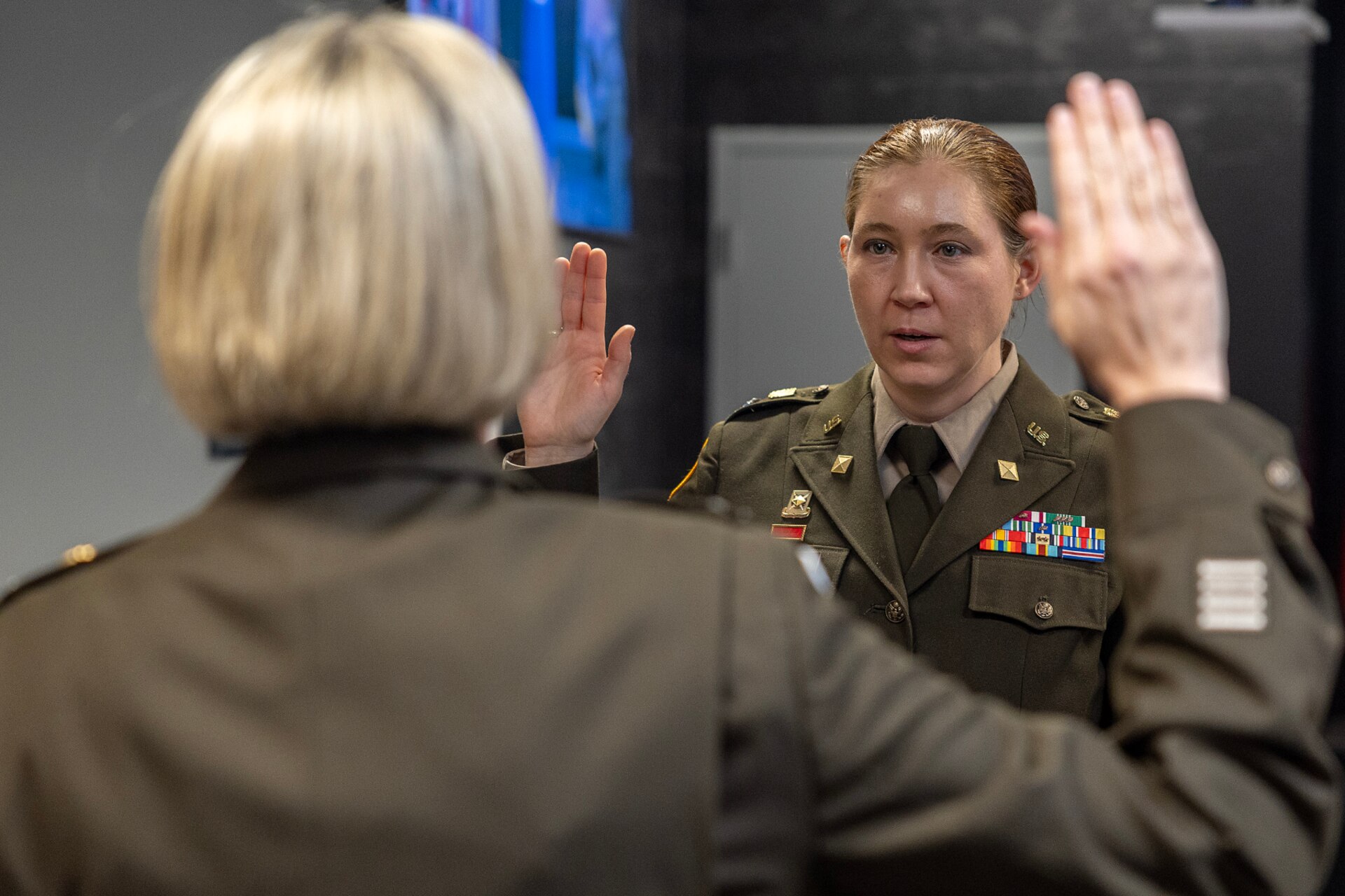 Col. Michelle M. Williams, U.S. Army Financial Management Command commander, administers an oath of office to Col. Jennifer S. Pampuch Borden, USAFMCOM Reserve Component senior advisor and U.S. Army Reserve Medical Command assistant chief of staff for resource management, during Pampuch Borden’s promotion ceremony at the Maj. Gen. Emmett J. Bean Federal Center in Indianapolis, Jan. 9, 2026. Since her graduation for the U.S. Military Academy at West Point, Pampuch Borden served in all three Army components as both a military police officer and finance officer. (U.S. Army photo by Mark R. W. Orders-Woempner)