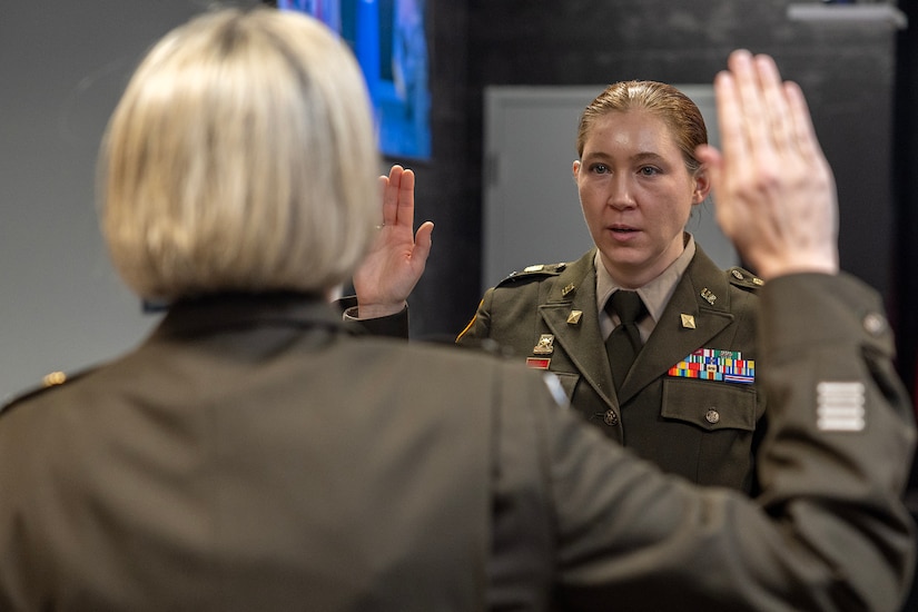 Col. Michelle M. Williams, U.S. Army Financial Management Command commander, administers an oath of office to Col. Jennifer S. Pampuch Borden, USAFMCOM Reserve Component senior advisor and U.S. Army Reserve Medical Command assistant chief of staff for resource management, during Pampuch Borden’s promotion ceremony at the Maj. Gen. Emmett J. Bean Federal Center in Indianapolis, Jan. 9, 2026. Since her graduation for the U.S. Military Academy at West Point, Pampuch Borden served in all three Army components as both a military police officer and finance officer. (U.S. Army photo by Mark R. W. Orders-Woempner)