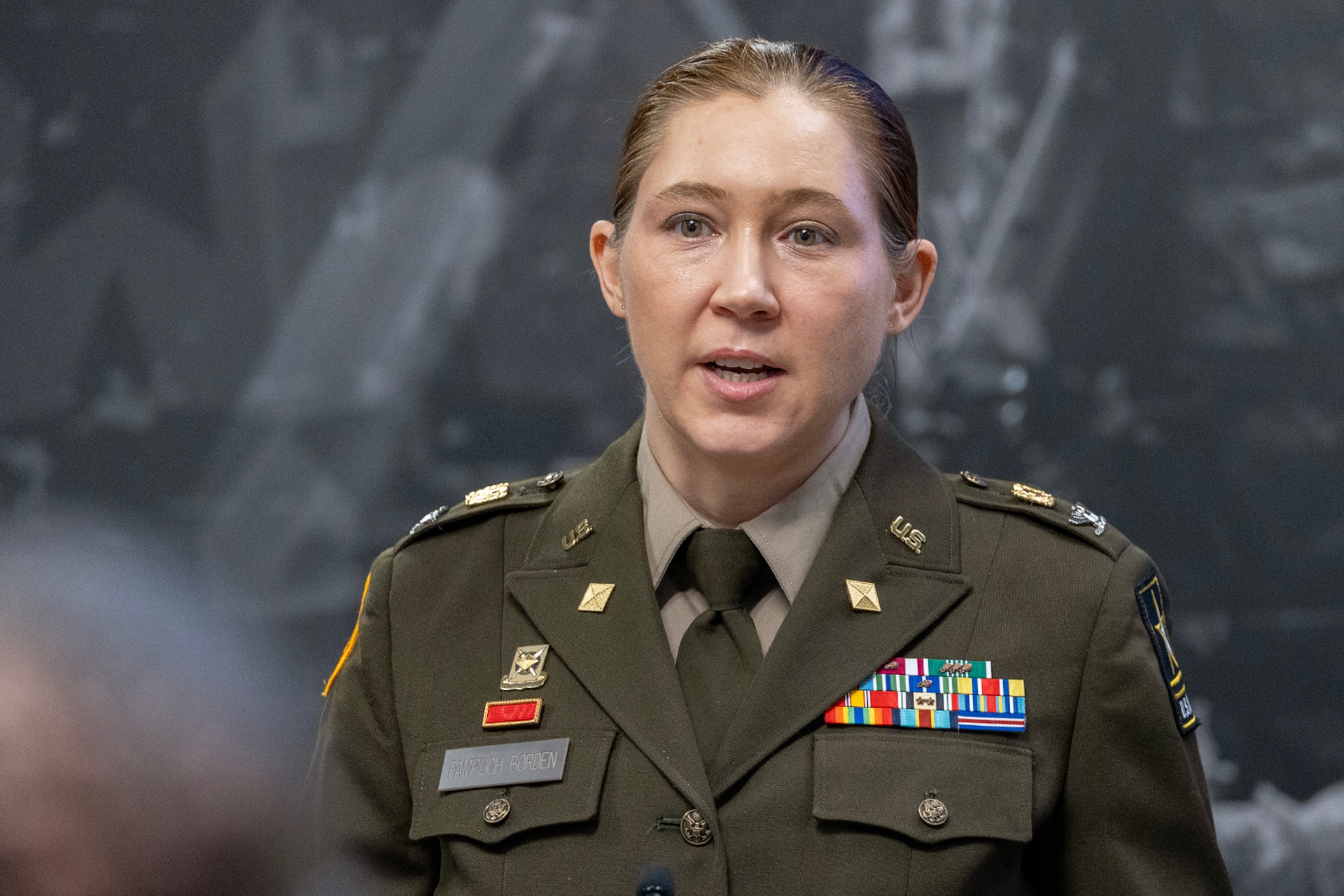Col. Jennifer S. Pampuch Borden, U.S. Army Financial Management Command Reserve Component senior advisor and U.S. Army Reserve Medical Command assistant chief of staff for resource management, delivers remarks during her promotion ceremony at the Maj. Gen. Emmett J. Bean Federal Center in Indianapolis, Jan. 9, 2026. Since her graduation for the U.S. Military Academy at West Point, Pampuch Borden served in all three Army components as both a military police officer and finance officer. (U.S. Army photo by Mark R. W. Orders-Woempner)