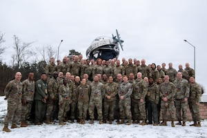 U.S. Air Force Team Ramstein leadership and chief master sergeant-selects pose for a group photo after notifying members of their promotion selections at Ramstein Air Base, Germany, January 8, 2026.