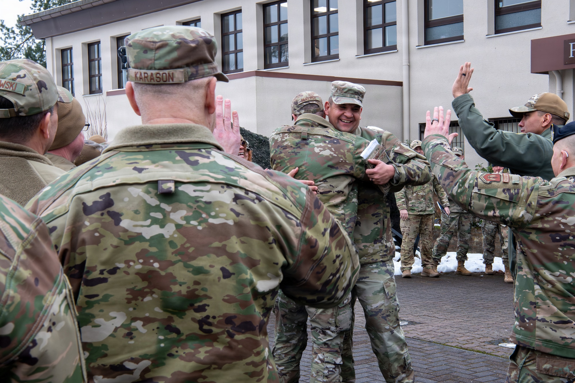 U.S. Air Force Senior Master Sgt. Joe Garcia Jr., 1st Engineer Installation Squadron senior enlisted leader, hugs a fellow Airman to celebrate his selection for promotion to chief at Ramstein Air Base, Germany, Jan. 8, 2026.
