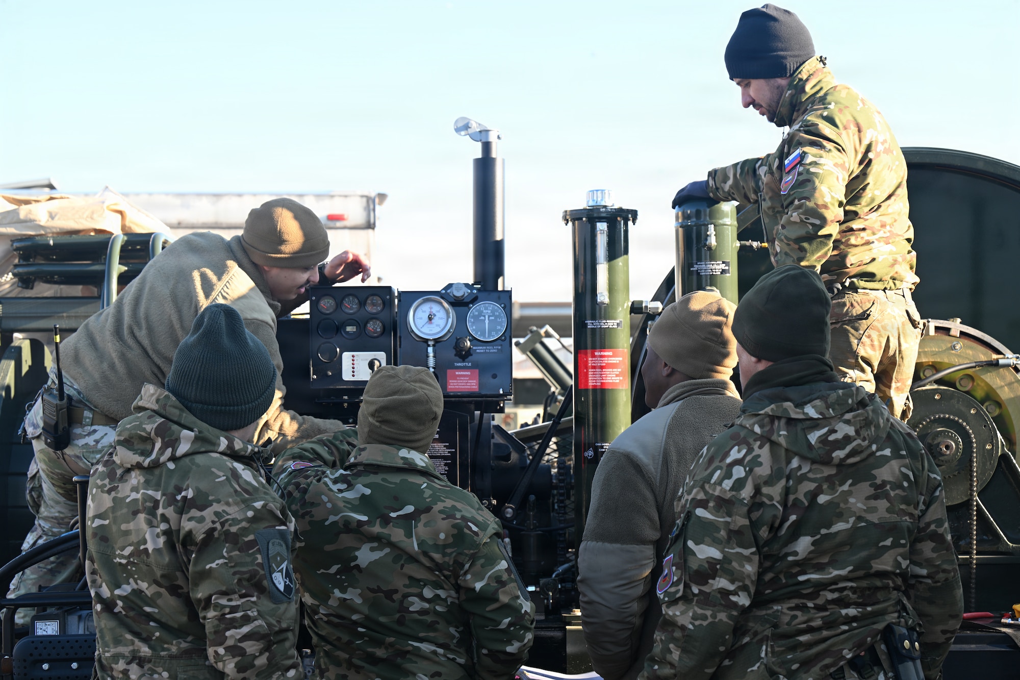 Service members works on the BAK-12 machine.