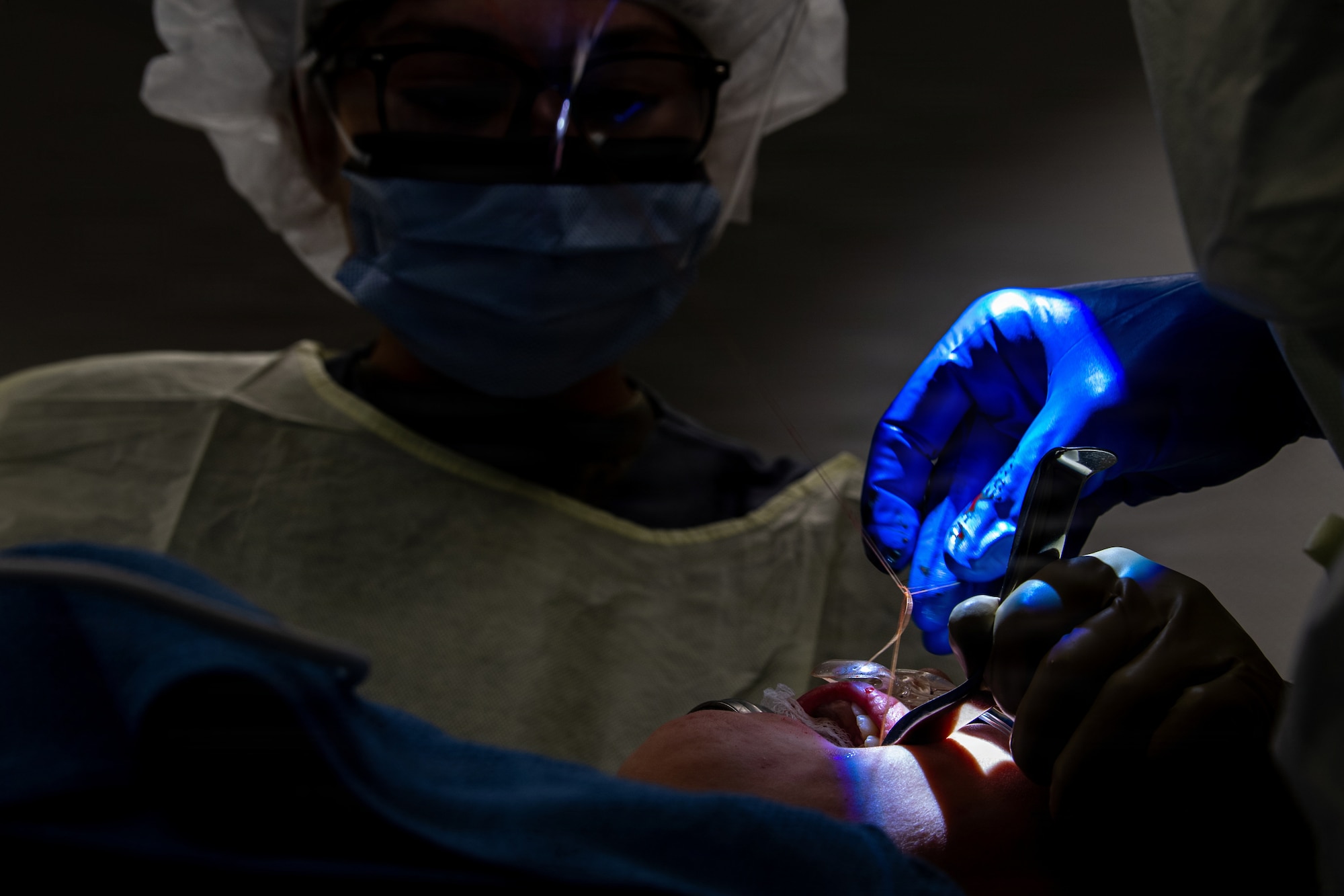 U.S. Air Force Maj. Matthew Van Hoof, right, 86th Dental Squadron oral and maxillofacial surgeon and Airman 1st Class Alexandria Busch,  86th DS dental assistant, perform oral surgery at Ramstein Air Base, Germany, Jan. 13. 2026.