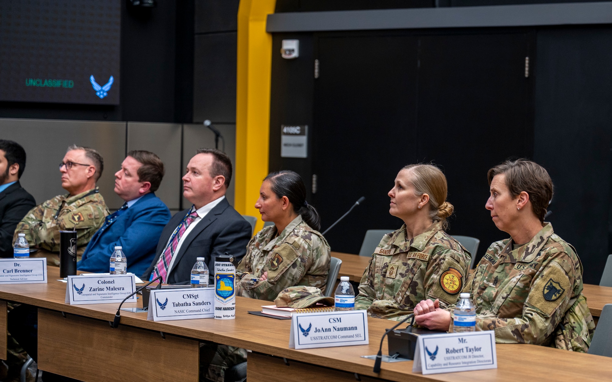 U.S. Army Command Sgt. Maj. Jo Naumann, far right, command senior enlisted leader, USSTRATCOM, sits alongside senior leaders from the National Air and Space Intelligence Center to receive a briefing by experts in the center’s Geospatial Intelligence Analysis Squadron during a visit to NASIC, Wright-Patterson Air Force Base, Ohio, Jan. 12, 2026. GSI is responsible for the creation of tailored, geospatially based intelligence and capabilities to deliver decision advantage for the warfighter, policymaker, and weapon acquisition community.
