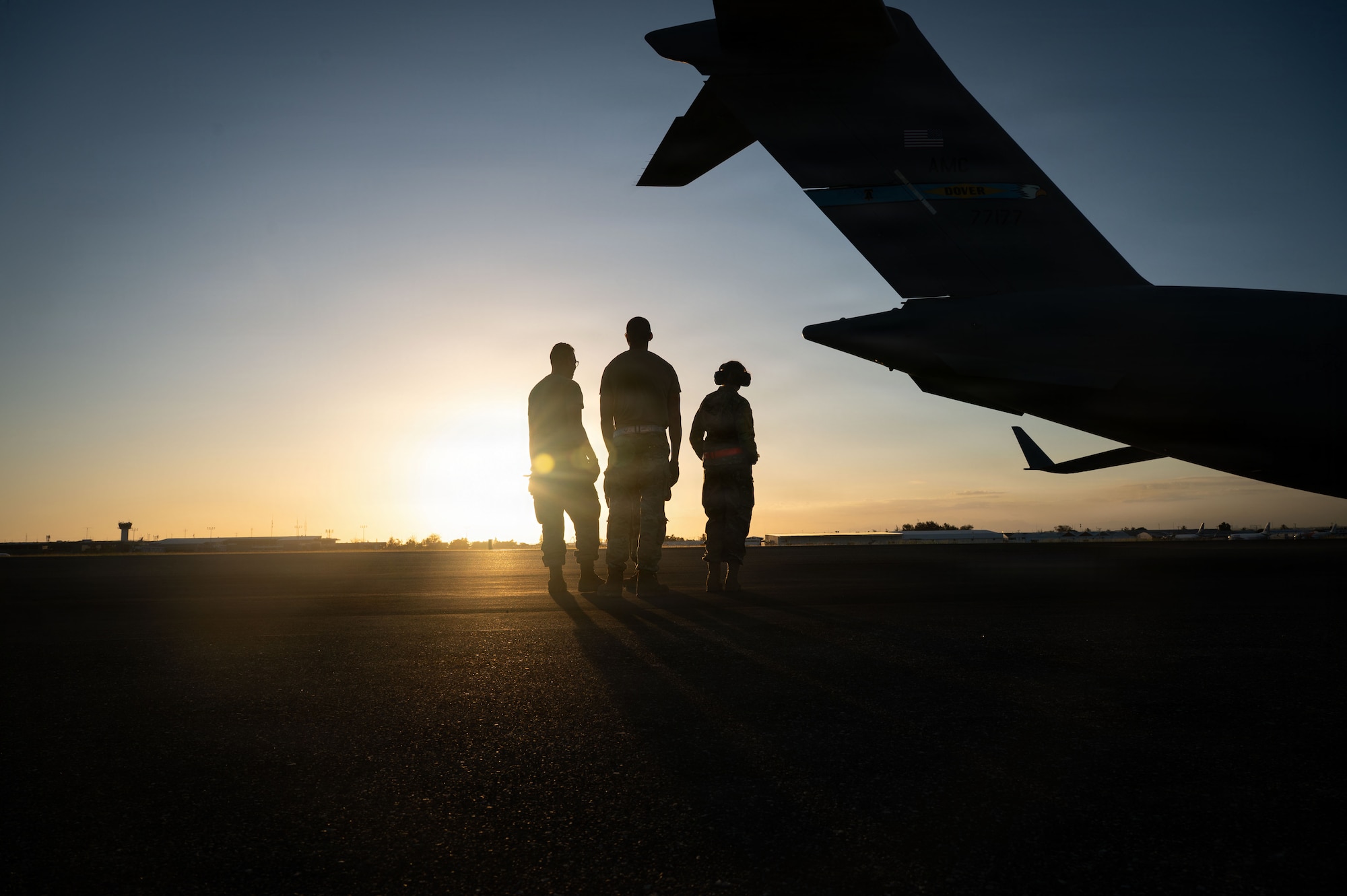 Airmen remove cargo from a C-17 cargo plane.