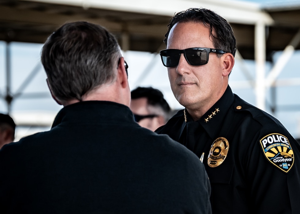 Brian Issitt (right), City of Goodyear Chief of Police, listens to a 62nd Aircraft Maintenance Unit flightline tour