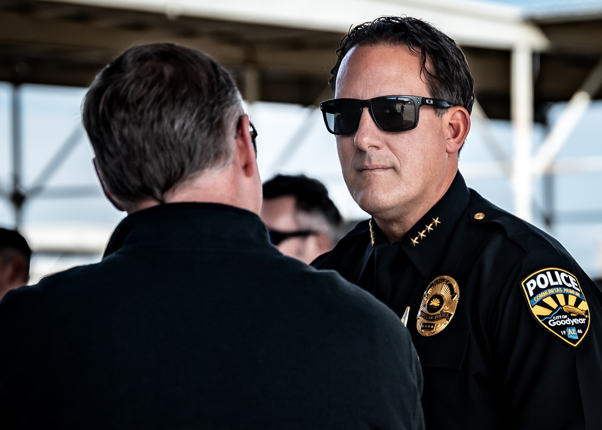 Brian Issitt (right), City of Goodyear Chief of Police, listens to a 62nd Aircraft Maintenance Unit flightline tour