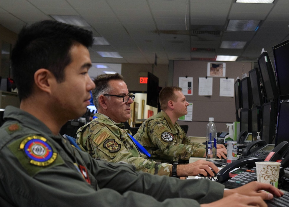 Airmen use computers.