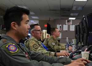 Airmen use computers.