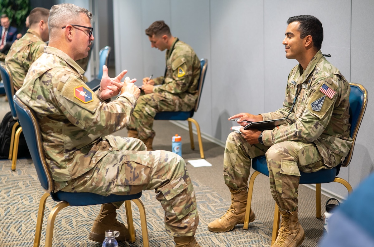 Col. Andy Dermanoski, Space Base Delta 3 commander, shares career insights with a captain during a Speed Mentoring session at Los Angeles Air Force Base on August 7, 2025. These rapid-fire mentoring rounds connect mentees with seasoned leaders for candid conversations on growth, opportunity and navigating the next steps. Whether the staff was seeking advice or offering it, this was their moment to engage and inspire. (U.S. Space Force photo by Mr. Van Ha)