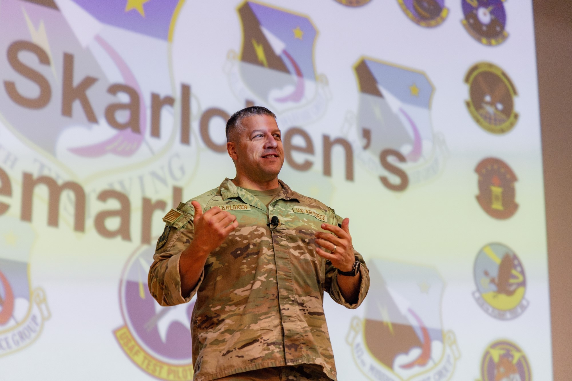 Chief Master Sgt. Joshua Skarloken, 412th Test Wing command chief master sergeant, encouraged Airmen to embrace change, keep a positive attitude and make responsible decisions during last week’s “Back-in-the-Saddle” All Call at the base theater. (Photo by Brandon Hernandez)