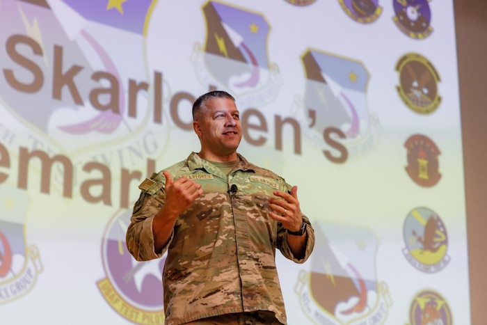 Chief Master Sgt. Joshua Skarloken, 412th Test Wing command chief master sergeant, encouraged Airmen to embrace change, keep a positive attitude and make responsible decisions during last week’s “Back-in-the-Saddle” All Call at the base theater. (Photo by Brandon Hernandez)