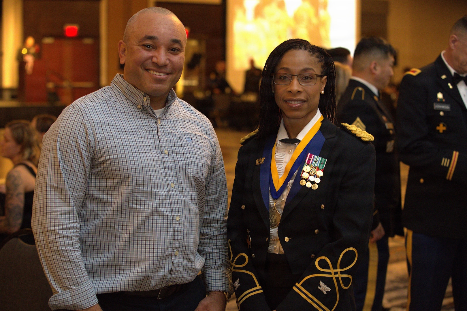 Col. Jessica McPherson poses for a photo with a guest at the 404th MEB Brigade Ball in Normal, Illinois, Jan. 10, 2026.