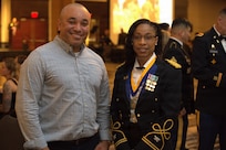 Col. Jessica McPherson poses for a photo with a guest at the 404th MEB Brigade Ball in Normal, Illinois, Jan. 10, 2026.
