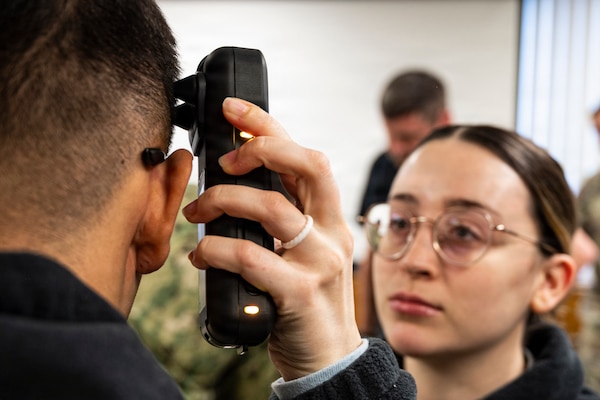 Hospital Corpsman 3rd Class Mikayla Bobbing operates a near infrared Traumatic Brain Injury assessment device during an end-user touchpoint hosted by the Operational Medical Systems Program Management Office, Camp Lejeune, North Carolina, Jan. 14, 2026. Bobbing, originally from the Philadelphia area, is assigned to the Naval Medical Center Camp Lejeune. The touchpoint at NMCCL is one in a series of planned engagements with prospective end users to help the OPMED Warfighter Readiness, Performance and Brain Health project management office refine the development of field-portable TBI detection devices designed for use in austere, remote locations across the globe. OPMED, part of the Defense Health Agency, partners with stakeholders across the Joint Force to develop, acquire, and field medical devices, treatments, and frontline care solutions for military medical providers to fill capability gaps with the speed of relevance. (Defense Health Agency photo by T. T. Parish/Released)