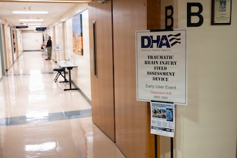 Team members with the Operational Medical Systems Program Management Office joined dozens of U.S. Navy corpsmen and medical officers for an end-user touchpoint at Naval Medical Center Camp Lejeune, North Carolina, to assess the progress of the TBI Field Assessment Program, January 14, 2026. The touchpoint at NMCCL is one in a series of planned engagements with prospective end users to help the OPMED Warfighter Readiness, Performance and Brain Health project management office refine the development of field-portable TBI detection devices designed for use in austere, remote locations across the globe. OPMED, part of the Defense Health Agency, partners with stakeholders across the Joint Force to develop, acquire, and field medical devices, treatments, and frontline care solutions for military medical providers to fill capability gaps with the speed of relevance. (Defense Health Agency photo by T. T. Parish/Released)