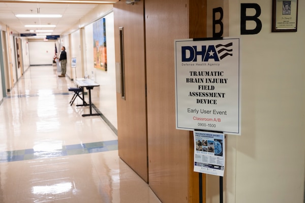 Team members with the Operational Medical Systems Program Management Office joined dozens of U.S. Navy corpsmen and medical officers for an end-user touchpoint at Naval Medical Center Camp Lejeune, North Carolina, to assess the progress of the TBI Field Assessment Program, January 14, 2026. The touchpoint at NMCCL is one in a series of planned engagements with prospective end users to help the OPMED Warfighter Readiness, Performance and Brain Health project management office refine the development of field-portable TBI detection devices designed for use in austere, remote locations across the globe. OPMED, part of the Defense Health Agency, partners with stakeholders across the Joint Force to develop, acquire, and field medical devices, treatments, and frontline care solutions for military medical providers to fill capability gaps with the speed of relevance. (Defense Health Agency photo by T. T. Parish/Released)