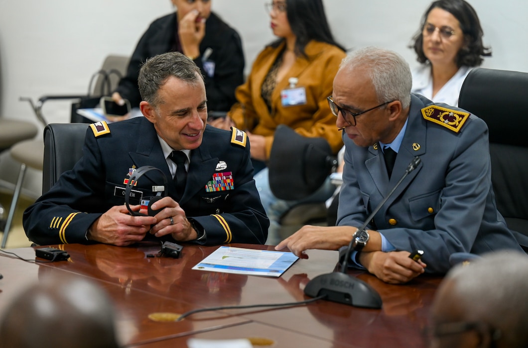 U.S. Army Col. Michael Cohen, U.S. Africa Command command surgeon, left, reviews a report with Moroccan Armed Forces Brig. Gen. Omar Agadr, Deputy Inspector of Morocco’s Military Health Service, right, during a tour of the Mohammed V Military Training Hospital in Rabat, Morocco, Dec. 10, 2025. Members attending the African Partner Outbreak Response Alliance 2025 Workshop received a tour of the hospital to see first-hand how the Moroccan Armed Forces respond and treat infectious diseases. (U.S. Air Force photo by Capt. Benjamin Aronson)