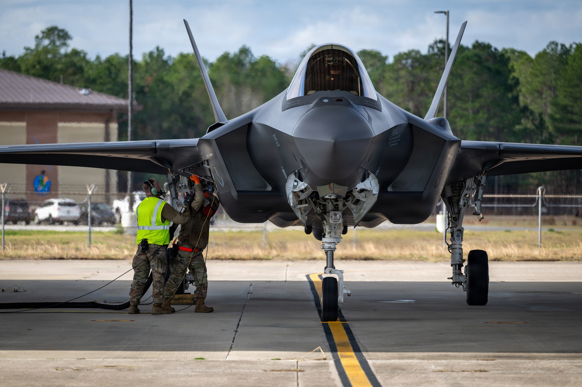 Two Air National Guard Airmen quickly fuel a F-35A Lightning II aircraft in a training exercise that ensures the jet can be refueled and quickly return to a mission.