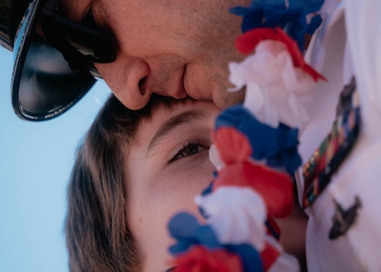 JOINT BASE PEARL HARBOR-HICKAM, Hawaii (Dec 8, 2025) –  Chief Machinist’s Mate Derek Hosley, assigned to Virginia-class fast-attack submarine USS Hawaii (SSN 776), meets his son pierside as Hawaii returns to its homeport at Joint Base Pearl Harbor-Hickam following a scheduled deployment, Dec. 8, 2025. Hawaii is assigned to Submarine Squadron 1 and is capable of supporting various missions, including anti-submarine warfare, anti-surface ship warfare, strike warfare, special operations forces support, and intelligence, surveillance, and reconnaissance. (U.S. Navy photo by Mass Communication Specialist 2nd Class Nicholas Russell)