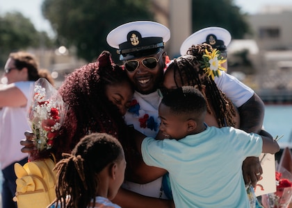 JOINT BASE PEARL HARBOR-HICKAM, Hawaii (Dec 8, 2025) – Chief Information Systems Technician, Submarines, Communications Deven Aiken, assigned to Virginia-class fast-attack submarine USS Hawaii (SSN 776), meets his family pierside as Hawaii returns to its homeport at Joint Base Pearl Harbor-Hickam following a scheduled deployment, Dec. 8, 2025. Hawaii is assigned to Submarine Squadron 1 and is capable of supporting various missions, including anti-submarine warfare, anti-surface ship warfare, strike warfare, special operations forces support, and intelligence, surveillance, and reconnaissance. (U.S. Navy photo by Mass Communication Specialist 2nd Class Nicholas Russell)
