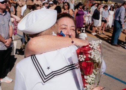 JOINT BASE PEARL HARBOR-HICKAM, Hawaii (Dec 8, 2025) - A Sailor assigned to Virginia-class fast-attack submarine USS Hawaii (SSN 776) meets his family pierside as Hawaii returns to its homeport at Joint Base Pearl Harbor-Hickam following a scheduled deployment, Dec. 8, 2025. Hawaii is assigned to Submarine Squadron 1 and is capable of supporting various missions, including anti-submarine warfare, anti-surface ship warfare, strike warfare, special operations forces support, and intelligence, surveillance, and reconnaissance. (U.S. Navy photo by Mass Communication Specialist 2nd Class Nicholas Russell)