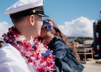 JOINT BASE PEARL HARBOR-HICKAM, Hawaii (Dec 8, 2025) - Chief Electrician’s Mate (Nuclear) John Martin, assigned to Virginia-class fast-attack submarine USS Hawaii (SSN 776), meets his daughter pierside as Hawaii returns to its homeport at Joint Base Pearl Harbor-Hickam following a scheduled deployment, Dec. 8, 2025. Hawaii is assigned to Submarine Squadron 1 and is capable of supporting various missions, including anti-submarine warfare, anti-surface ship warfare, strike warfare, special operations forces support, and intelligence, surveillance, and reconnaissance. (U.S. Navy photo by Mass Communication Specialist 2nd Class Nicholas Russell)