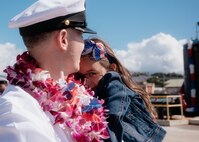 JOINT BASE PEARL HARBOR-HICKAM, Hawaii (Dec 8, 2025) - Chief Electrician’s Mate (Nuclear) John Martin, assigned to Virginia-class fast-attack submarine USS Hawaii (SSN 776), meets his daughter pierside as Hawaii returns to its homeport at Joint Base Pearl Harbor-Hickam following a scheduled deployment, Dec. 8, 2025. Hawaii is assigned to Submarine Squadron 1 and is capable of supporting various missions, including anti-submarine warfare, anti-surface ship warfare, strike warfare, special operations forces support, and intelligence, surveillance, and reconnaissance. (U.S. Navy photo by Mass Communication Specialist 2nd Class Nicholas Russell)