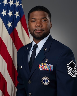 Official portrait of then-Master Sgt. Chavis Kendrick prior to commissioning. Kendrick later earned his commission through Officer Training School and now serves as a Cyber Warfare Officer.