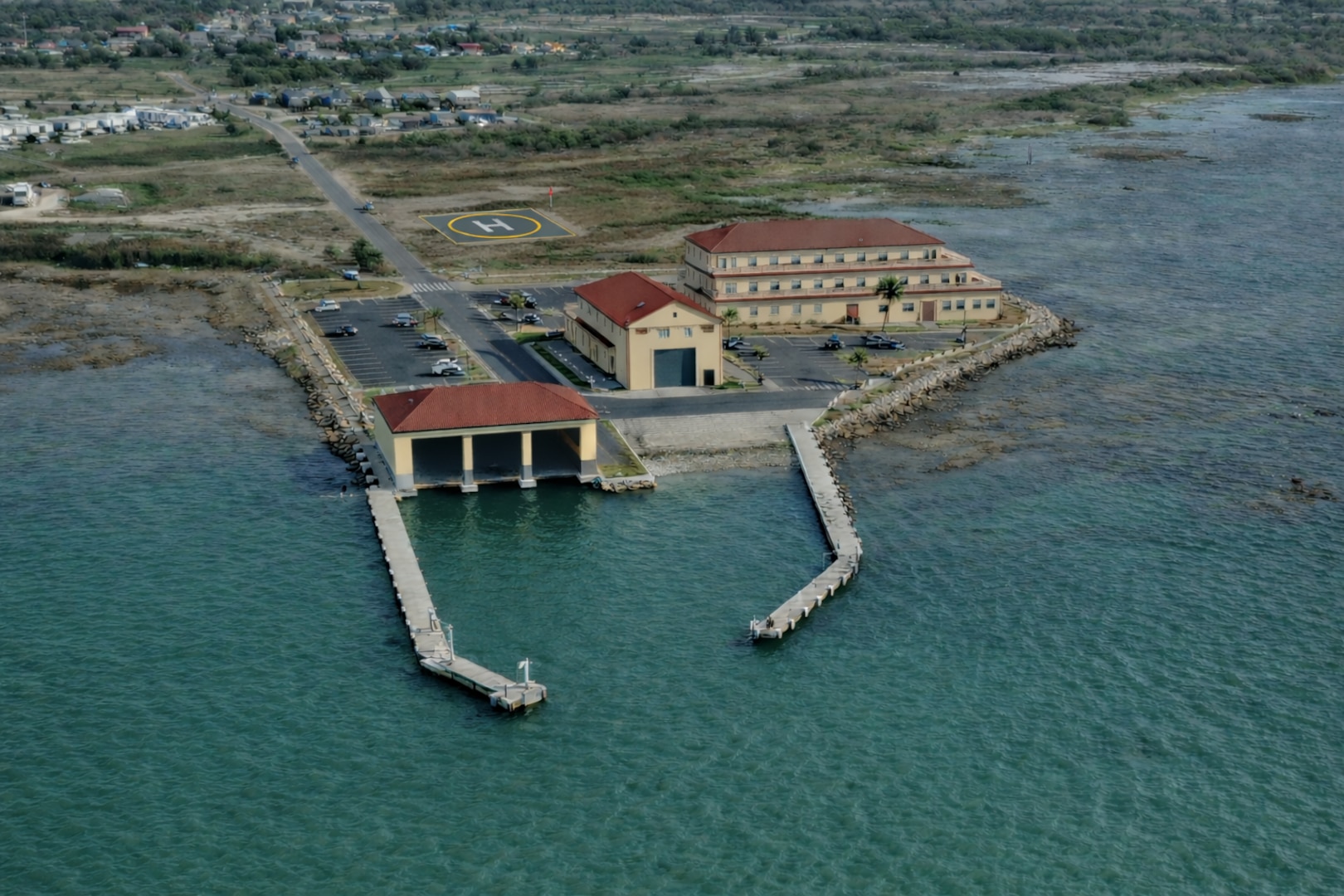 An architectural rendering depicts the future U.S. Coast Guard Station South Padre Island, Texas. The $200 million recapitalization project includes new operational, support, and waterfront facilities, and is scheduled for completion in 2028. (U.S. Coast Guard courtesy illustration)