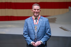 Steve Hiatt pauses on stage.