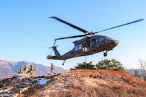 U.S. Army Soldiers assigned to 2nd Battalion, 2nd Aviation Regiment, 2nd Combat Aviation Brigade, 2d Infantry Division/ROK-U.S. Combined Division, alongside 1st Battalion, 38th Infantry Regiment, 1st Stryker Brigade Combat Team, 4th Infantry Division, conduct fast-rope air assault isolated personnel extraction training, Dec. 18, 2025.