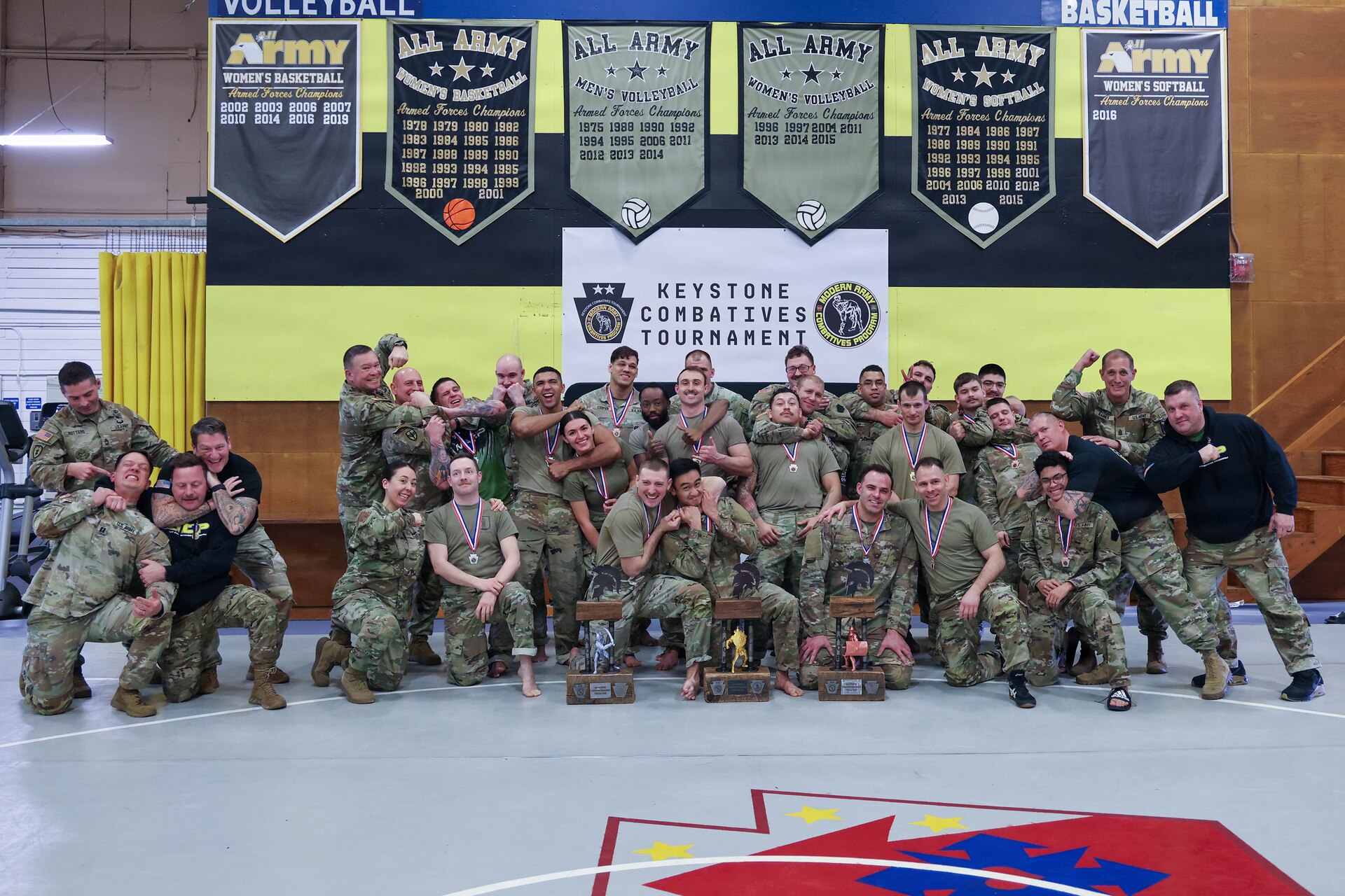 Senior Enlisted Advisor John Raines, senior enlisted advisor to the chief of the National Guard Bureau, poses with competitors following the awards ceremony at the inaugural Pennsylvania National Guard Keystones Combatives Tournament in Fort Indiantown Gap, Pa., Jan. 11, 2026.