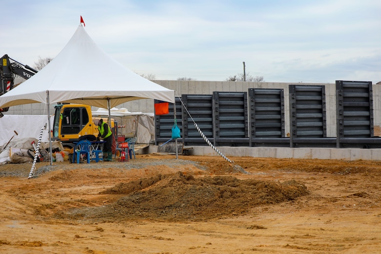 Concrete placement is being executed at aviation project site.