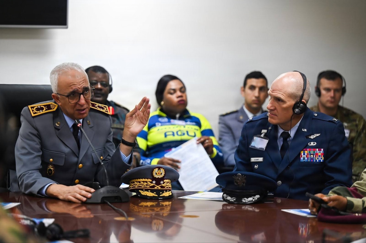 Moroccan Armed Forces Brig. Gen. Omar Agadr, Deputy Inspector of Morocco’s Military Health Service, left, and U.S. Air Force Col. Thomas Stamp, U.S. Air Forces in Europe - Air Forces Africa command surgeon, right, participate in a brief during a tour at the Mohammed V Military Training Hospital in Rabat, Morocco, Dec. 10, 2025. African Partner Outbreak Response Alliance 2025 Workshop attendees received a tour of the hospital to see first-hand how the Moroccan Armed Forces respond and treat infectious diseases. (U.S. Air Force photo by Capt. Benjamin Aronson) (This photo was altered for security purposes by blurring a security badge.)
