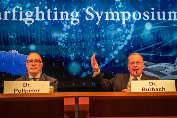 Dr. Kevin Pollpeter, Director of Research for the China Aerospace Studies Institute, and Professor David T. Burbach, Ph.D., Director of the Naval War College Space Studies Group, answer questions during Naval War College’s Future Warfighting Symposium onboard Naval Station Newport, Rhode Island, August 7, 2025 (U.S. Navy/Connor Burns)